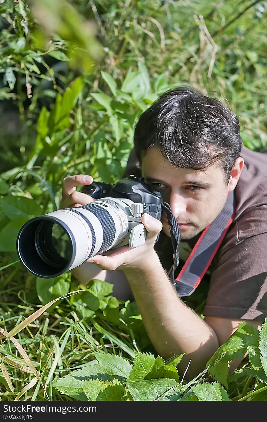 Young bird watcher with photo camera