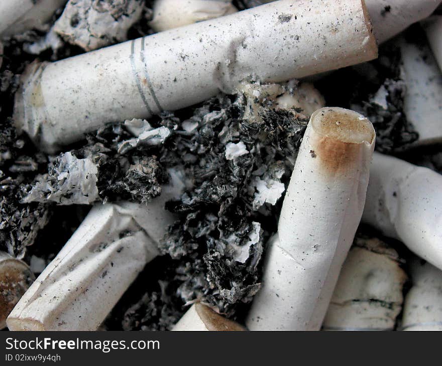 Close-up of ashtray with cigarette butts