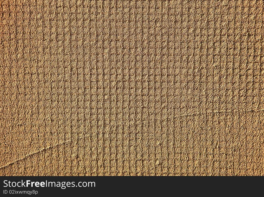 Wall rough surface texture with square pattern visible underneath. Wall rough surface texture with square pattern visible underneath.