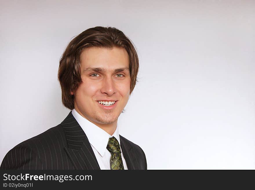 Young businessman in suit with smiling. Young businessman in suit with smiling