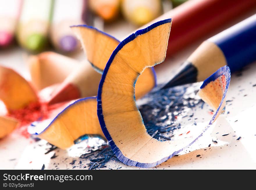 Sharpened pencils and wood shavings isolated on white