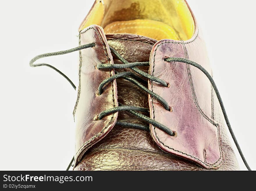 Mens shoe with black shoe strings.