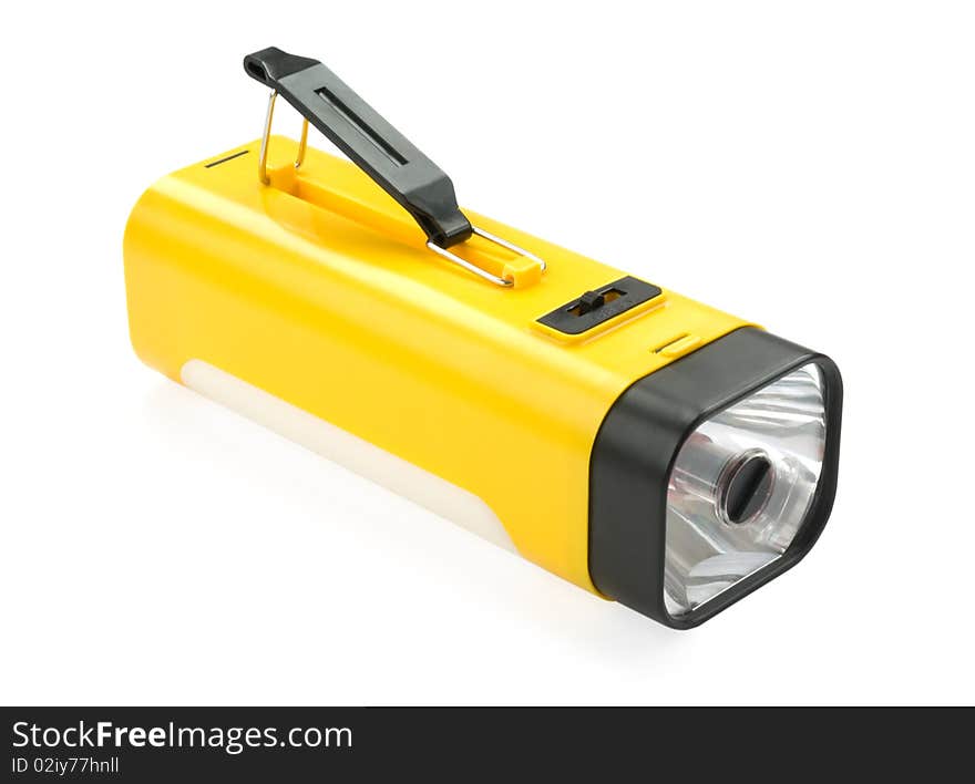 Battery yellow flashlight isolated over white background