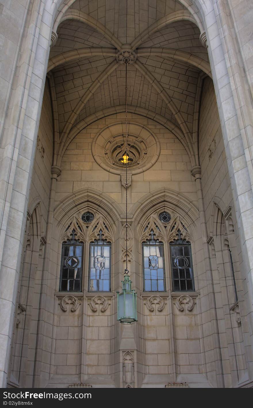 A chandaler hanging in the entrace to a chatedral. A chandaler hanging in the entrace to a chatedral.