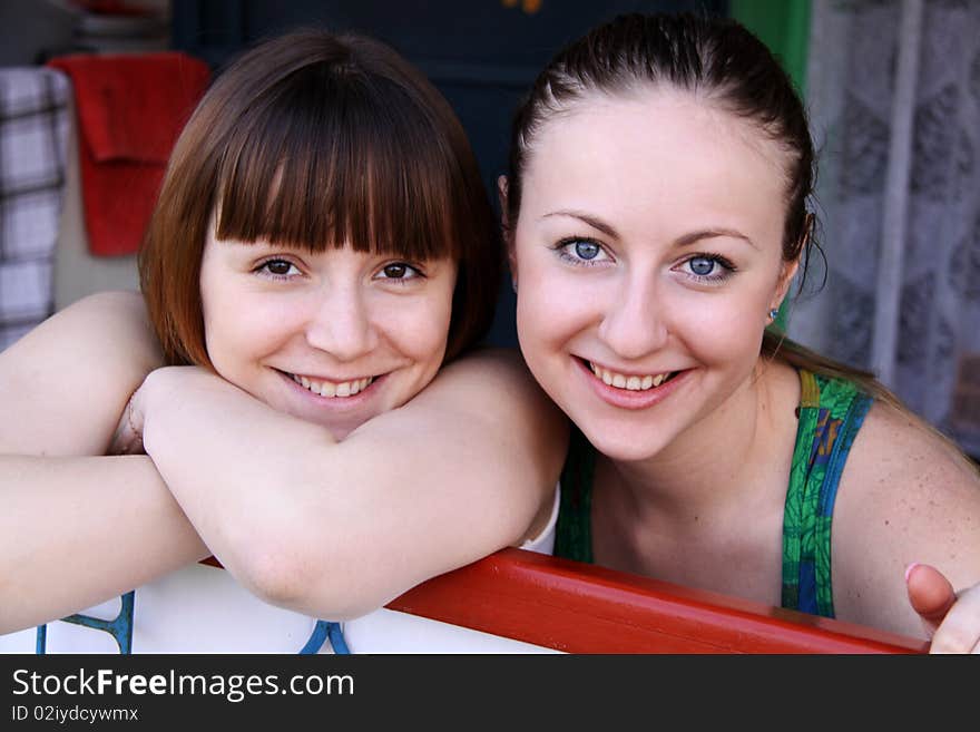 Two happy young women - closeup. Two happy young women - closeup