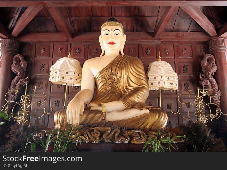 Blissful buddha sit in wood house