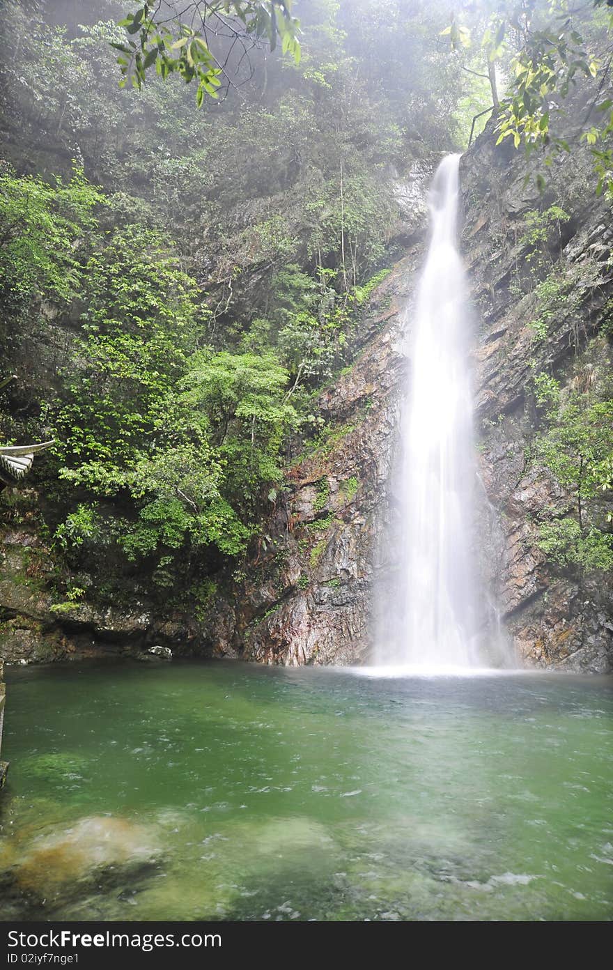 The beautiful waterfall and  vegetation , in China park. The beautiful waterfall and  vegetation , in China park