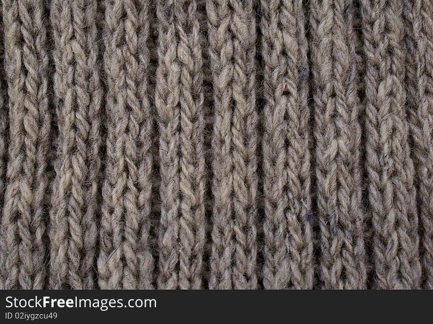 Woolen texture-abstract background from sewing knitting needle