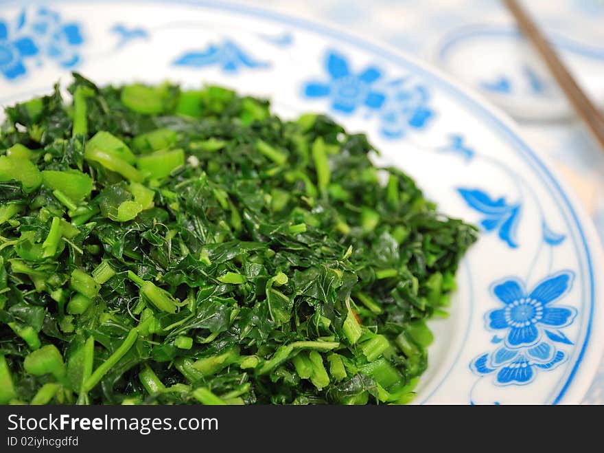 Simple green leafy vegetables from the Brassica Rapa family cooked Chinese style. For concepts such as food and beverage, diet and nutrition, and healthy eating.