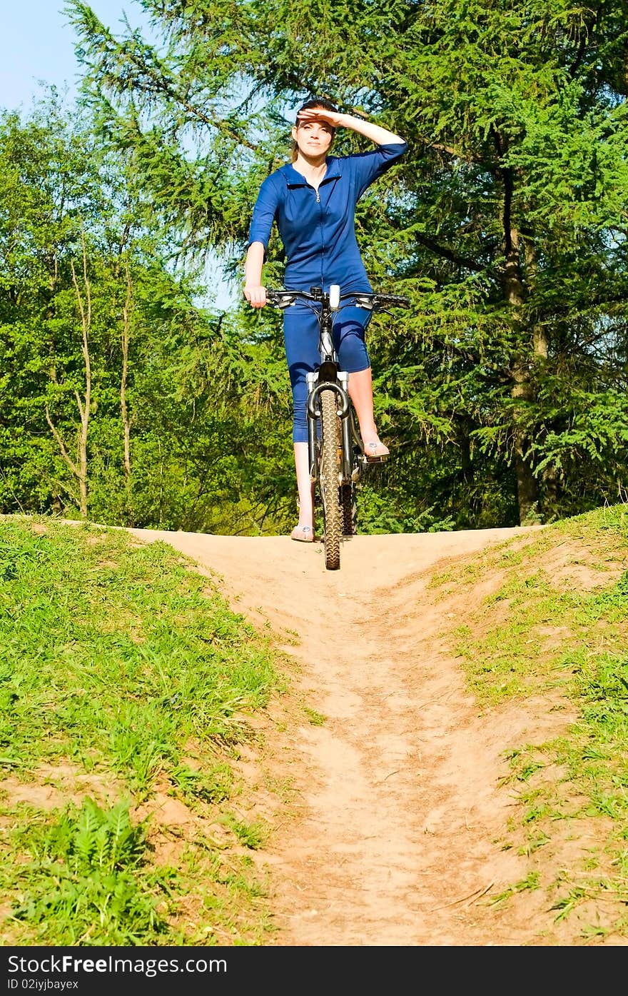 Pretty young woman on bicycle. Pretty young woman on bicycle