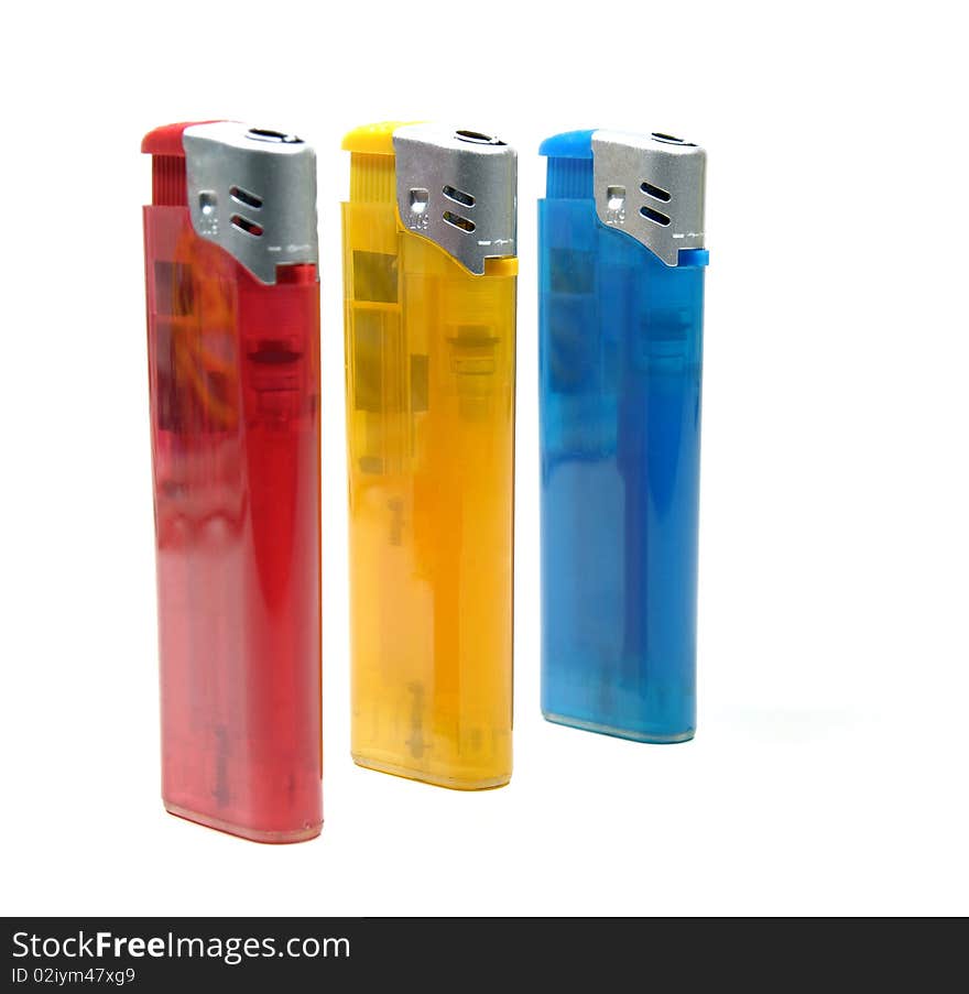 Three colorful lighters on white background