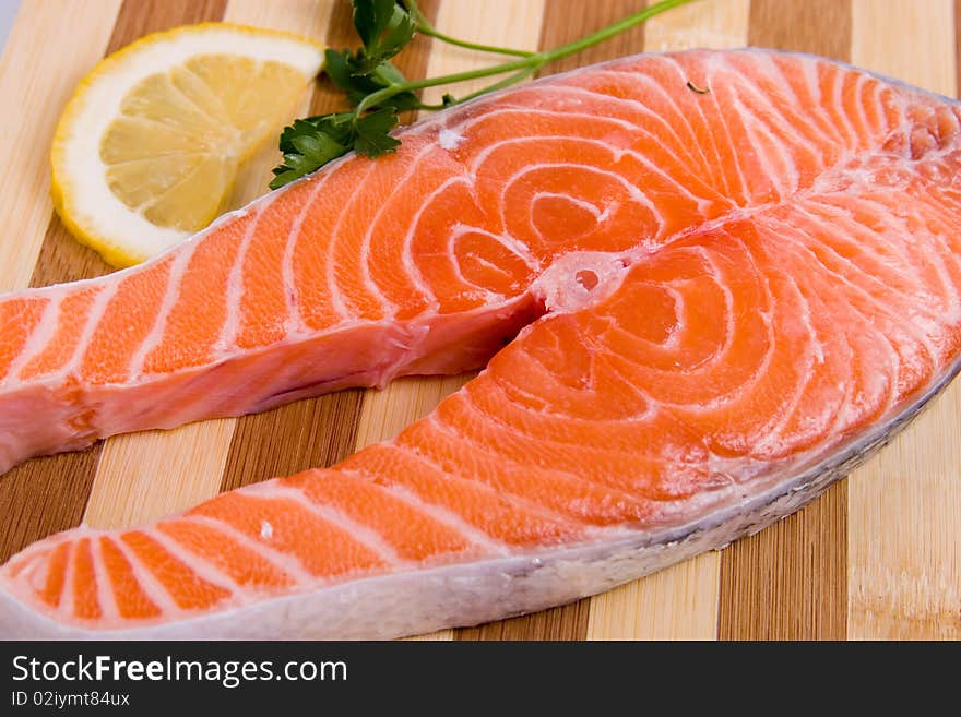 Raw salmon on a wooden board