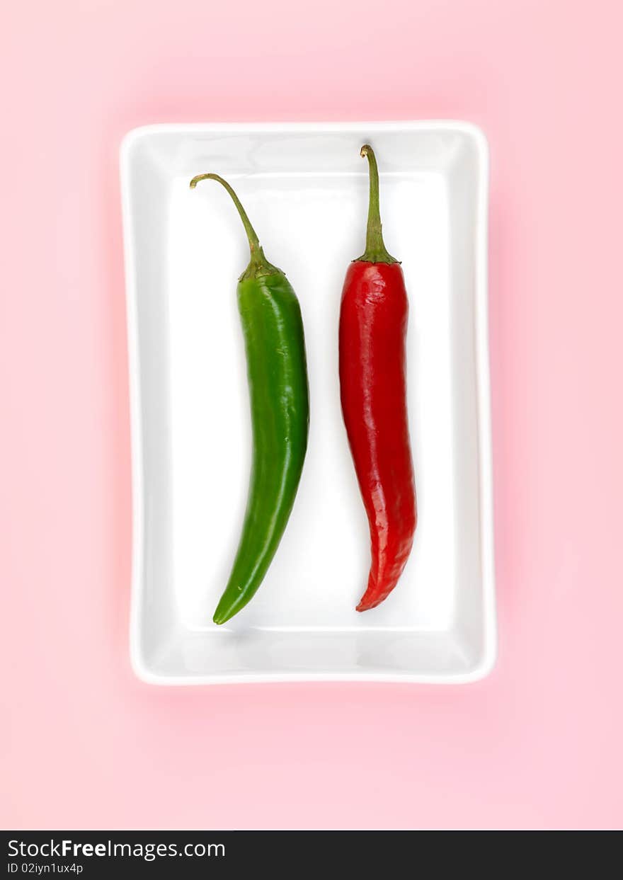 Chilli Peppers isolated on a pink background