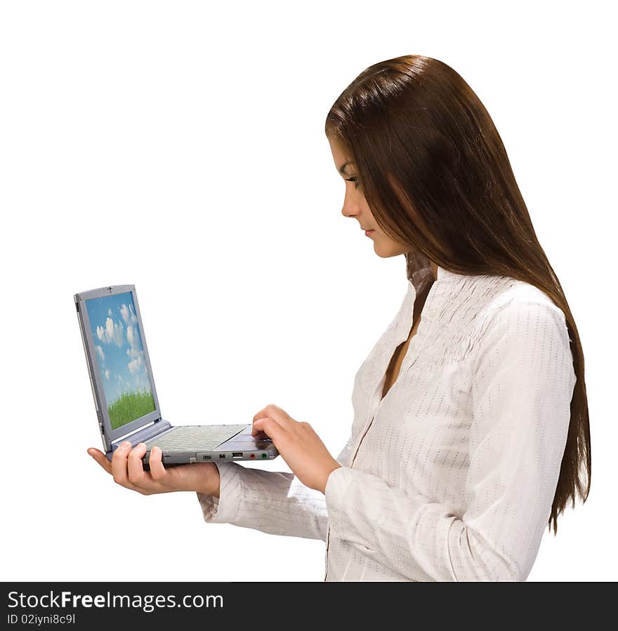 Attractive young woman at work on her laptop computer. Attractive young woman at work on her laptop computer