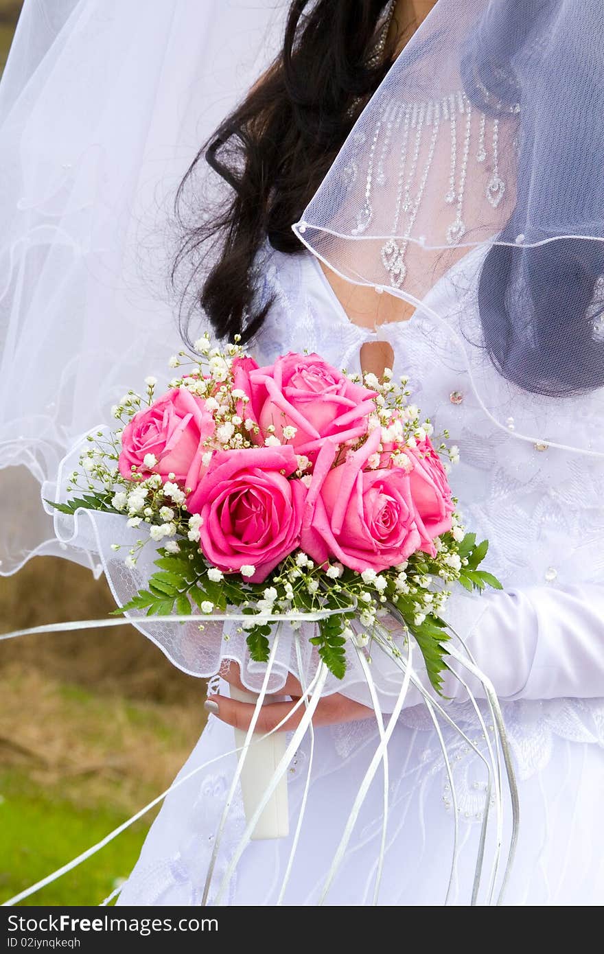 Beautiful bridal bouquet in the hands of the bride