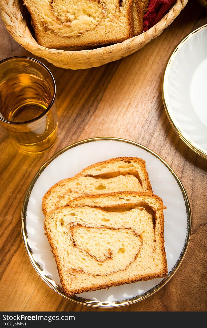 Freshly made cinnamon swirl bread on white plate