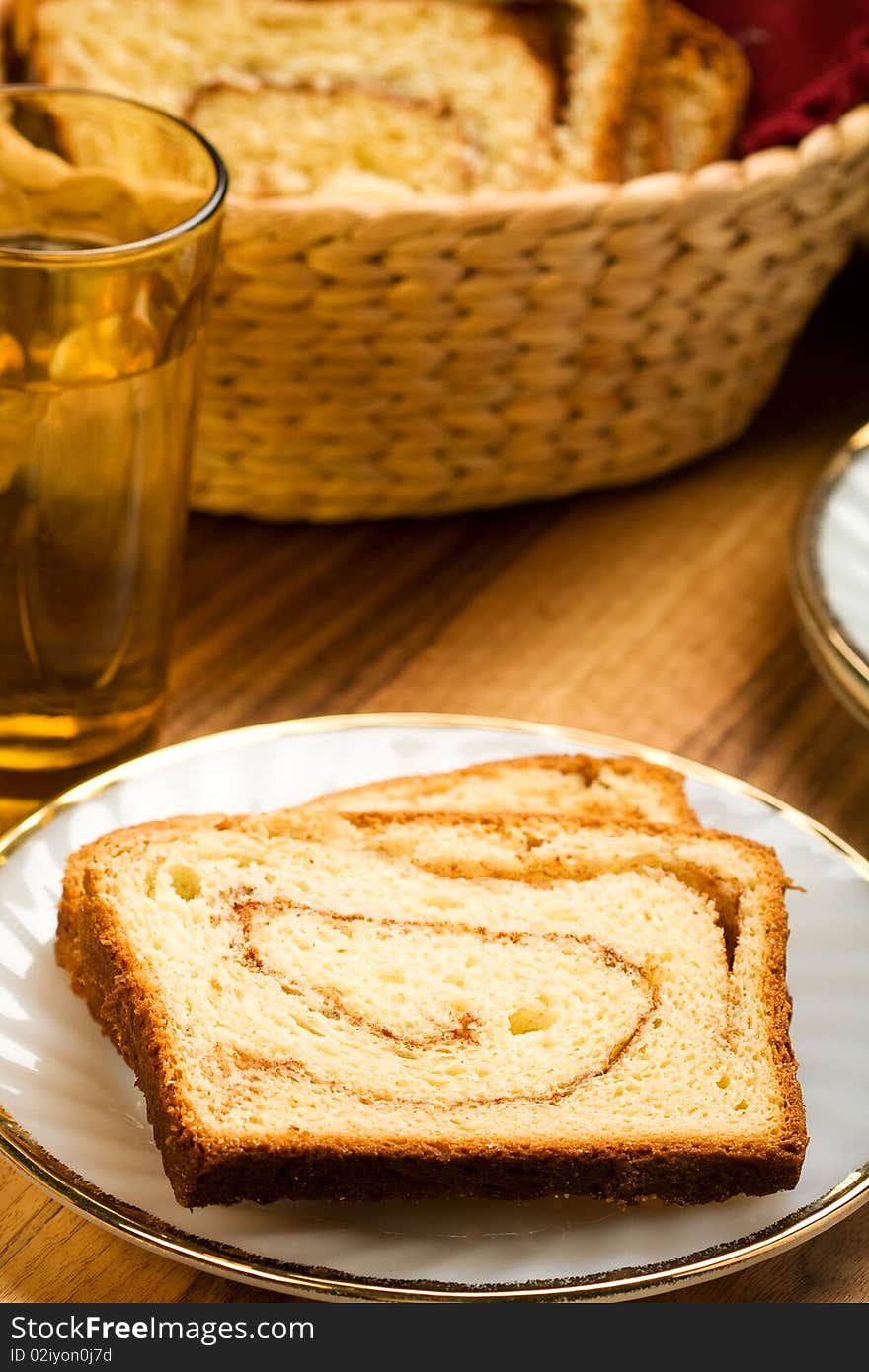 Freshly made cinnamon swirl bread on white plate