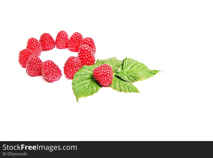 Fresh ripe raspberries and green leaves isolated on a white background. Fresh ripe raspberries and green leaves isolated on a white background.