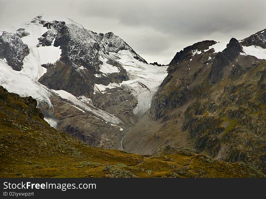 Glaciers on the high mountains near the Suestenpass in the Swiss Alps, in early autumn. Glaciers on the high mountains near the Suestenpass in the Swiss Alps, in early autumn.