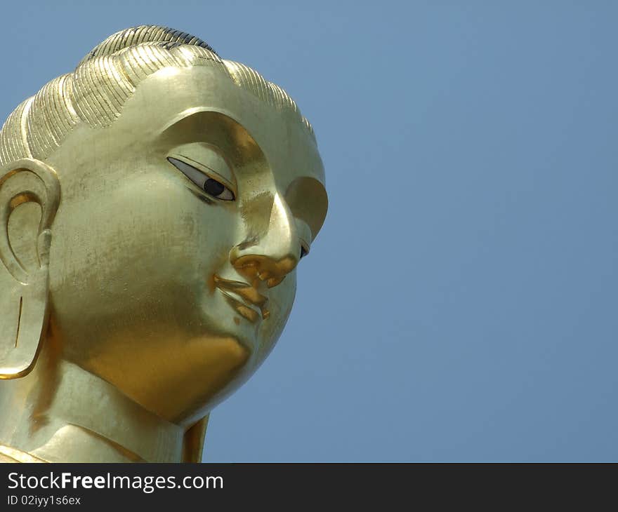 The face of the big Buddha image in Prachuabkirikhan Province, Thailand. The face of the big Buddha image in Prachuabkirikhan Province, Thailand