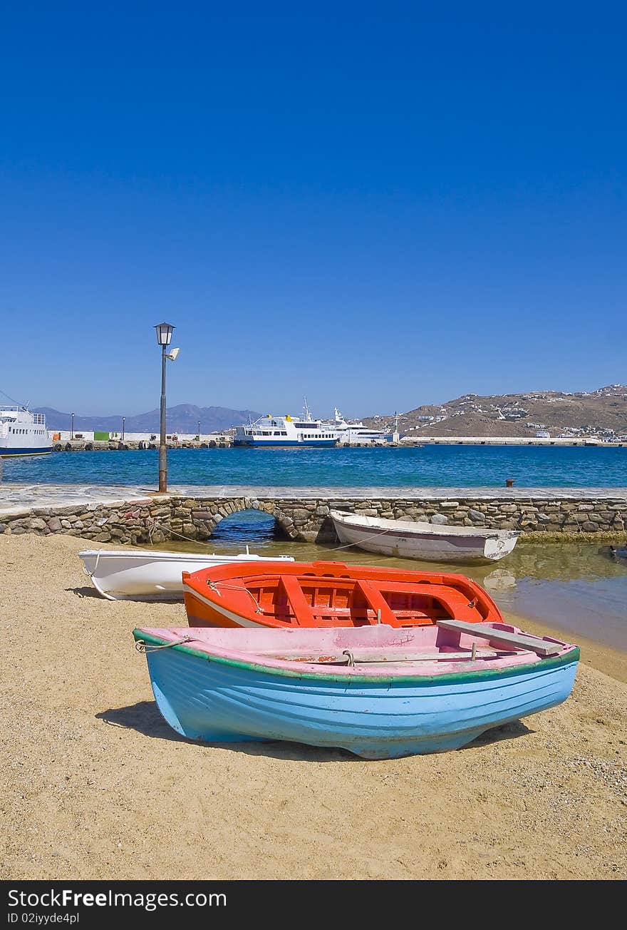 Fishing boats on sandy beach Mykonos