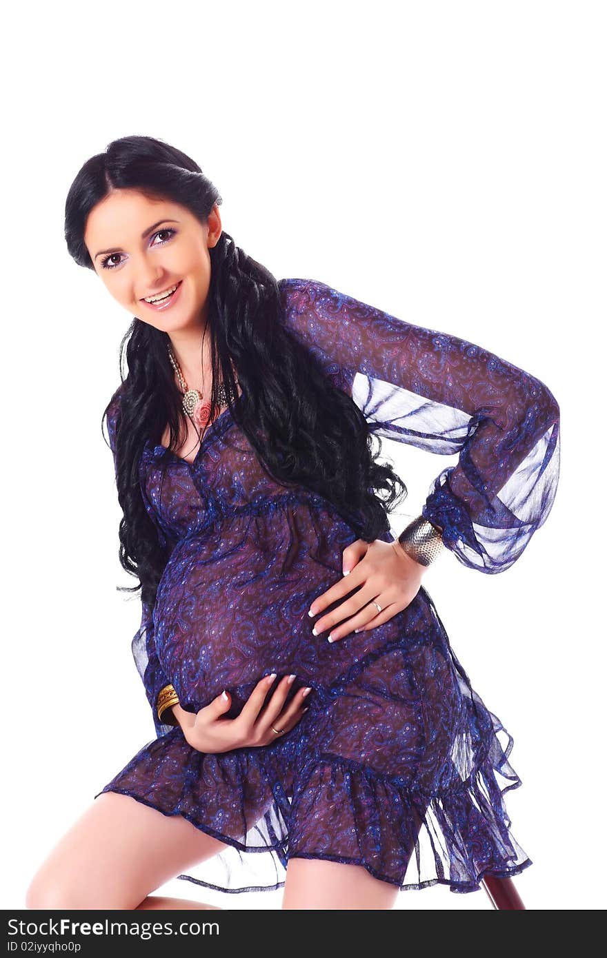 Beautiful elegant pregnant woman holding tummy proudly. Beautiful elegant pregnant woman holding tummy proudly