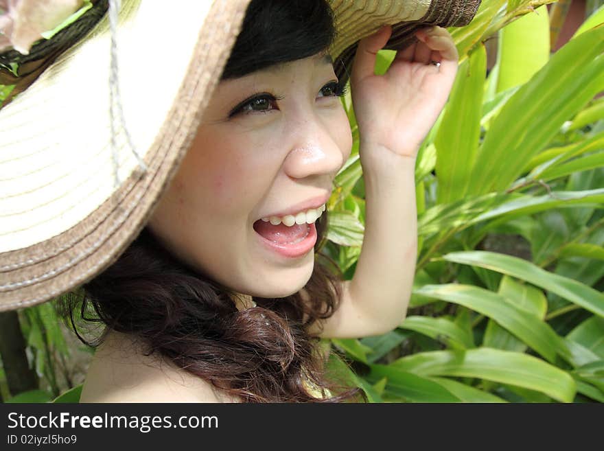 A happy asian girl with beautiful hat. A happy asian girl with beautiful hat