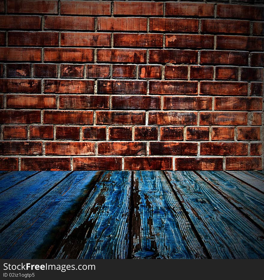 Part of the room of bricks and wooden floor. Part of the room of bricks and wooden floor