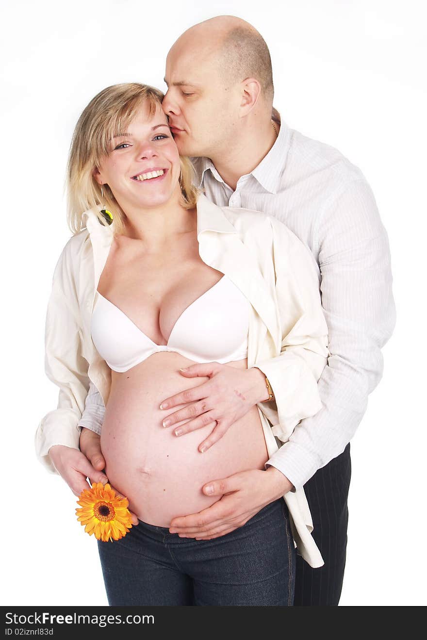 Pregnant woman poses with her husband. Not a young pair. Pregnant woman poses with her husband. Not a young pair