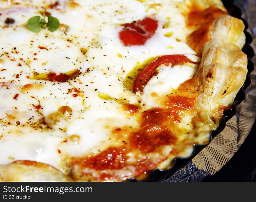 Baked italian pizza with tomato and mozzarella