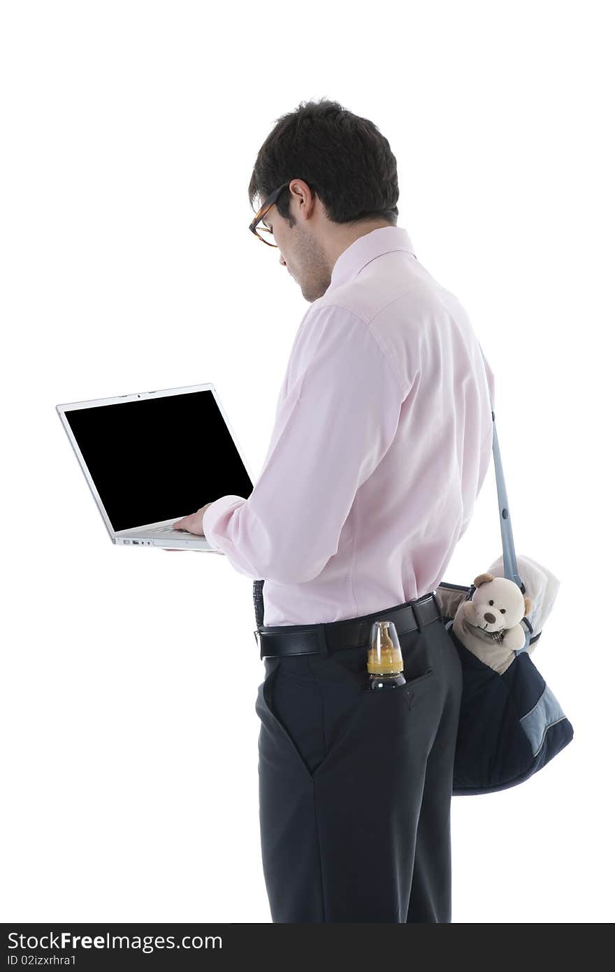 Businessman with laptop, milk bottle and diaper bag. Concept: multi-tasking, modern man