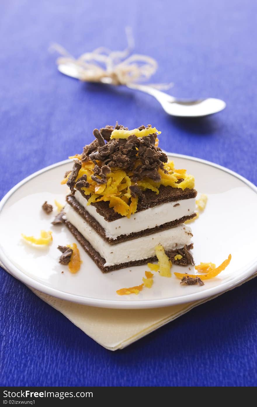 Chocolate cake with orange and bizet on plate