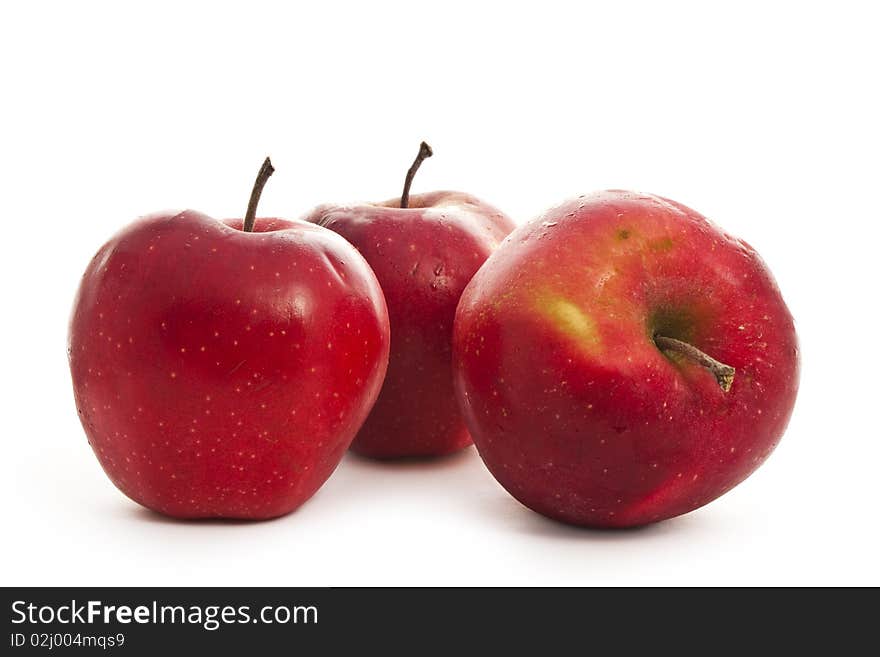 Three red apples isolated on white