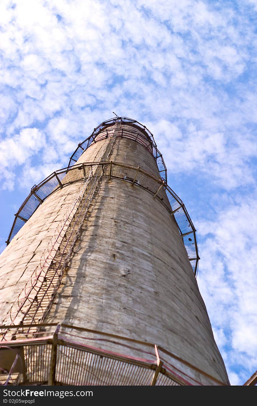 Industry chimney in a blue sky on sunny day