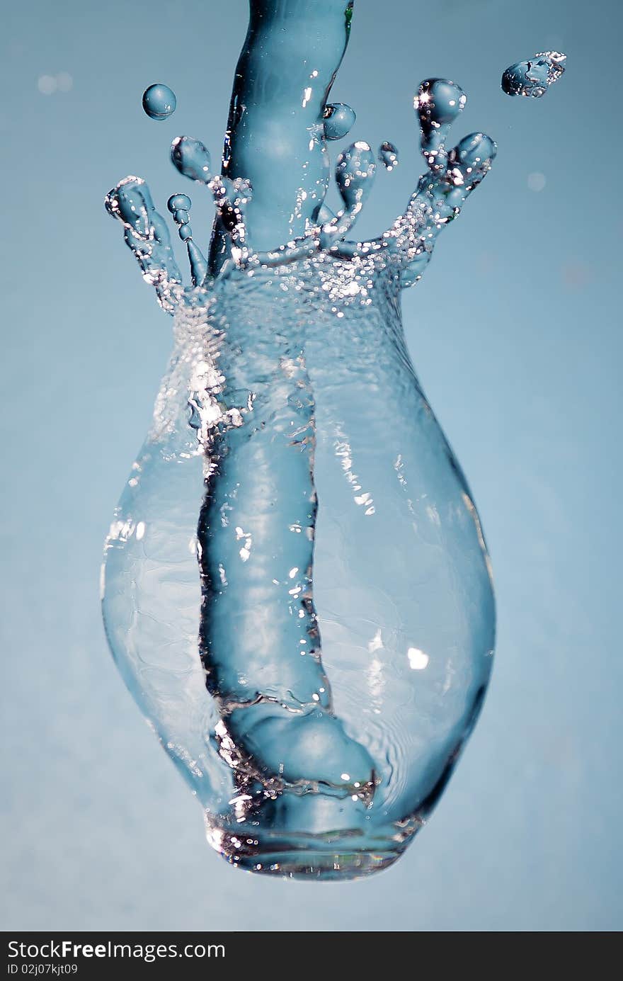 Splash water on light blue background