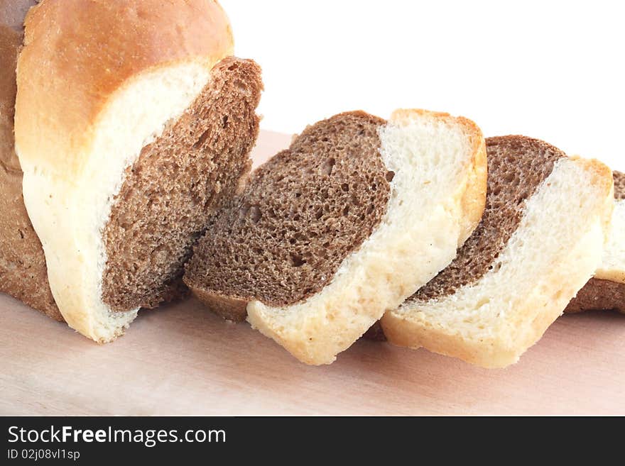 The loaf of bread is cut into pieces