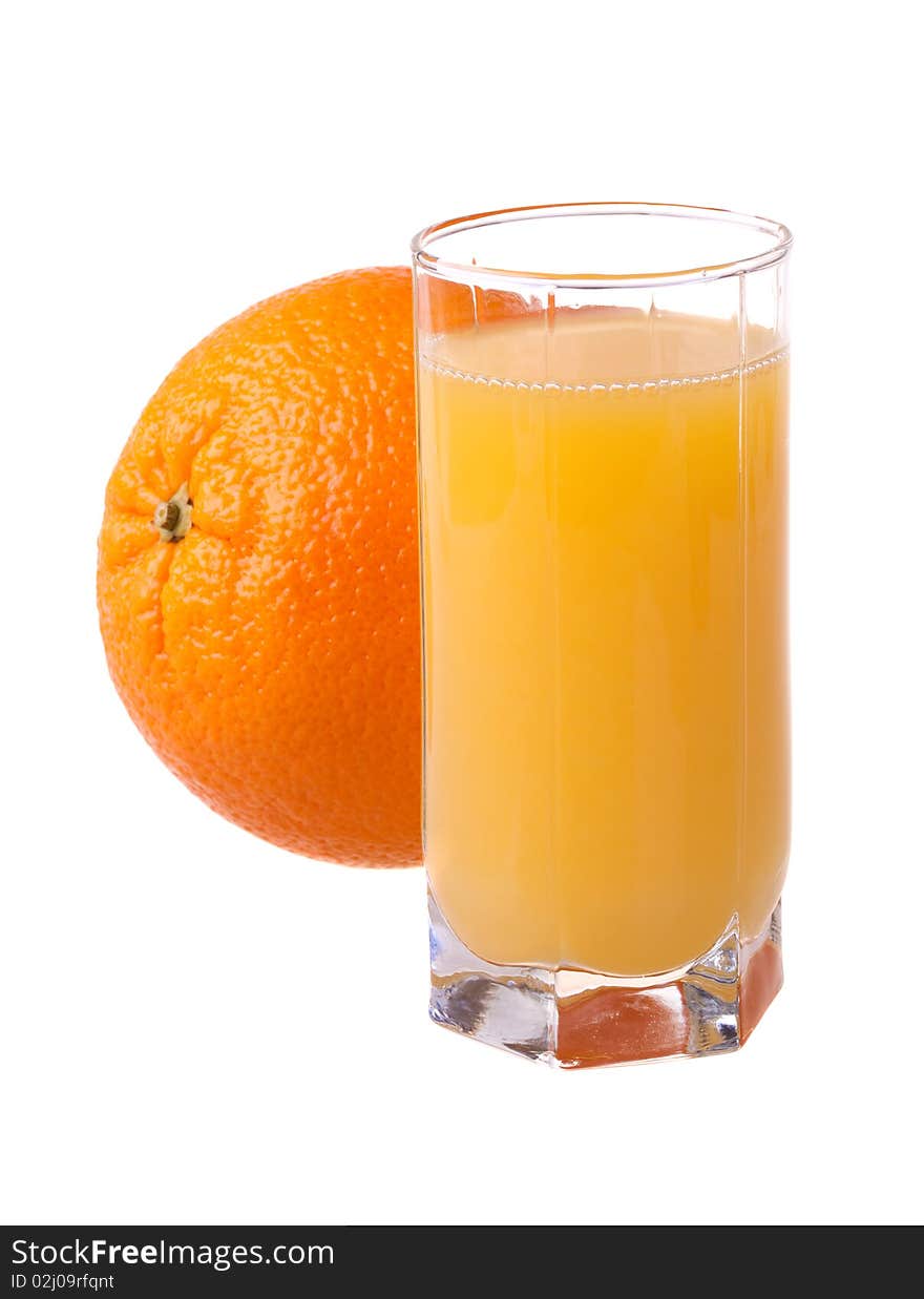 Glass of fresh orange juice with ripe orange