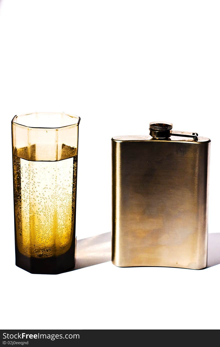 Glass vessels standing on the white table, isolated background