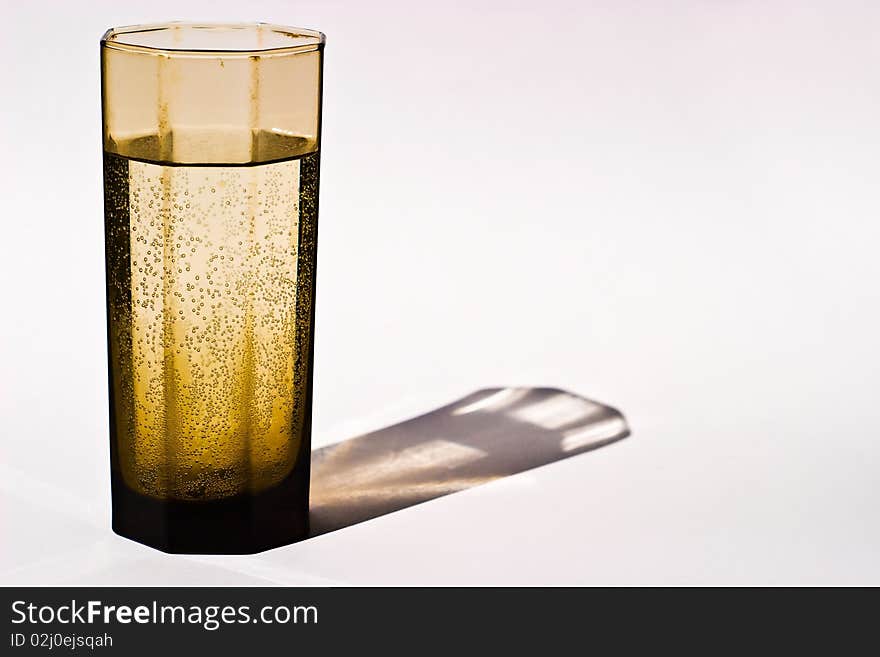 Glass vessels standing on the white table, isolated background