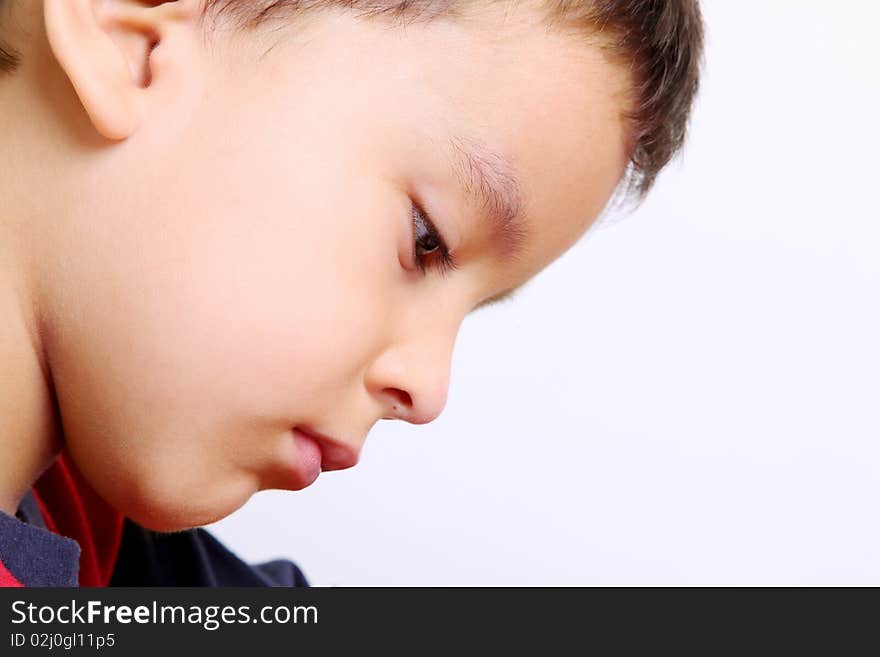 Close up of child writing and looking. Close up of child writing and looking