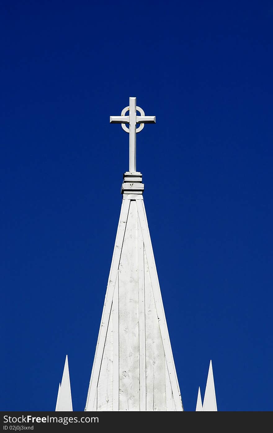 Steeple of Church with blue sky in background. Steeple of Church with blue sky in background