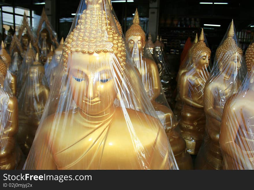 Buddha statues in a shop in Bangkok, Thailand. Buddha statues in a shop in Bangkok, Thailand.