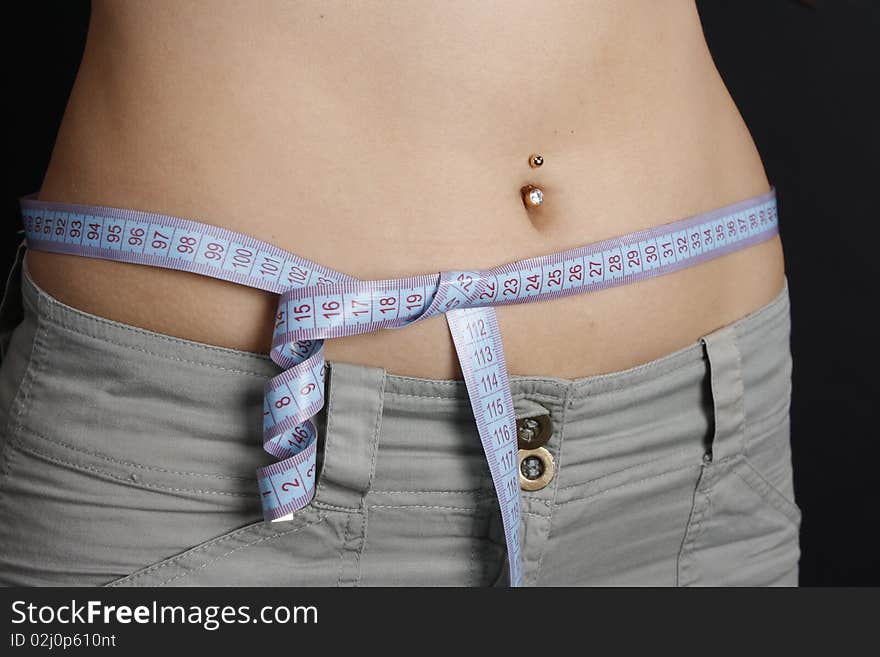 Woman Measuring Her Waist