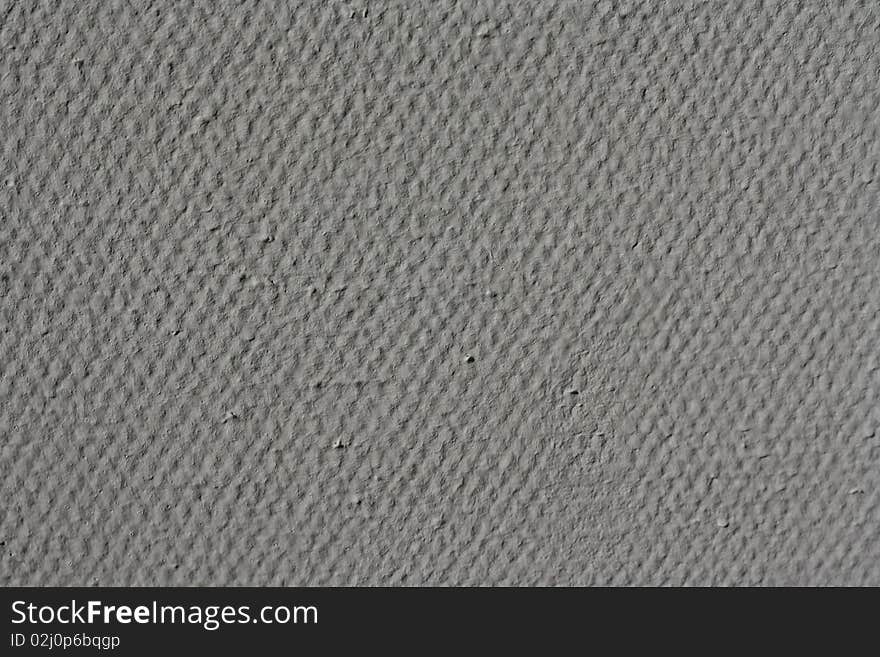 Grey wall with uneven texture