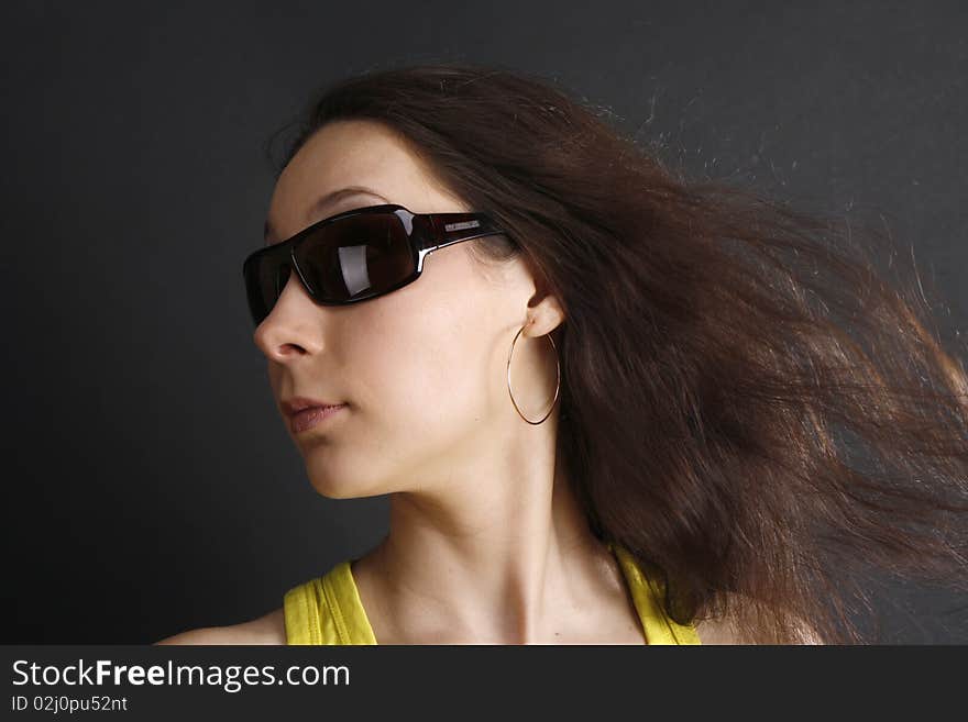 A portrait of a woman in sun glasses