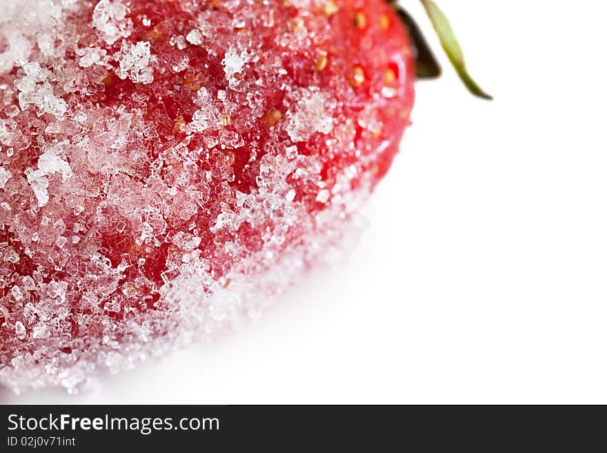 Macro shot of a strawberry dredged with sugar isolated on white