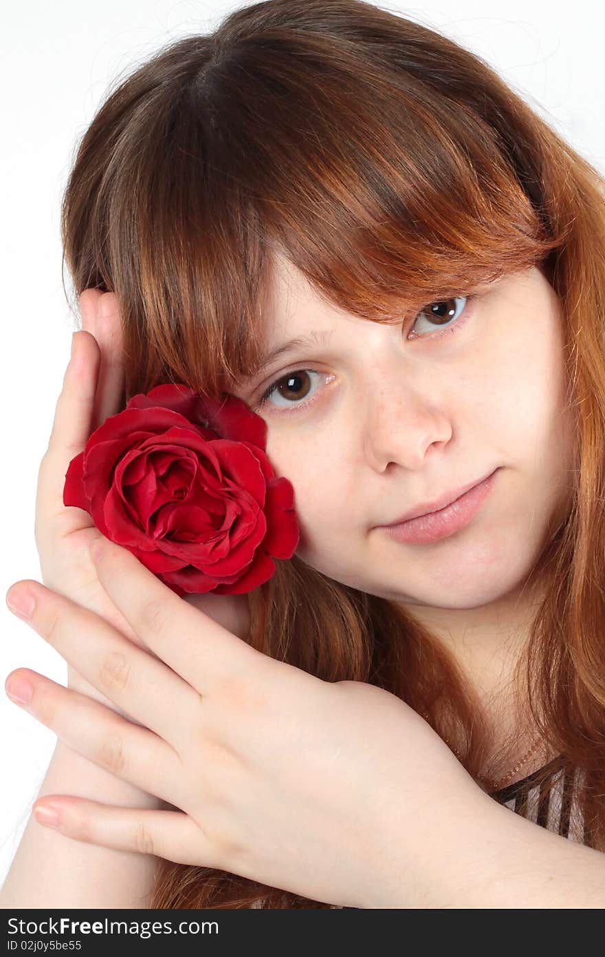 Pretty young woman with a flower in the hands