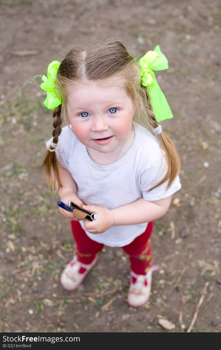 Little girl playing in the garden