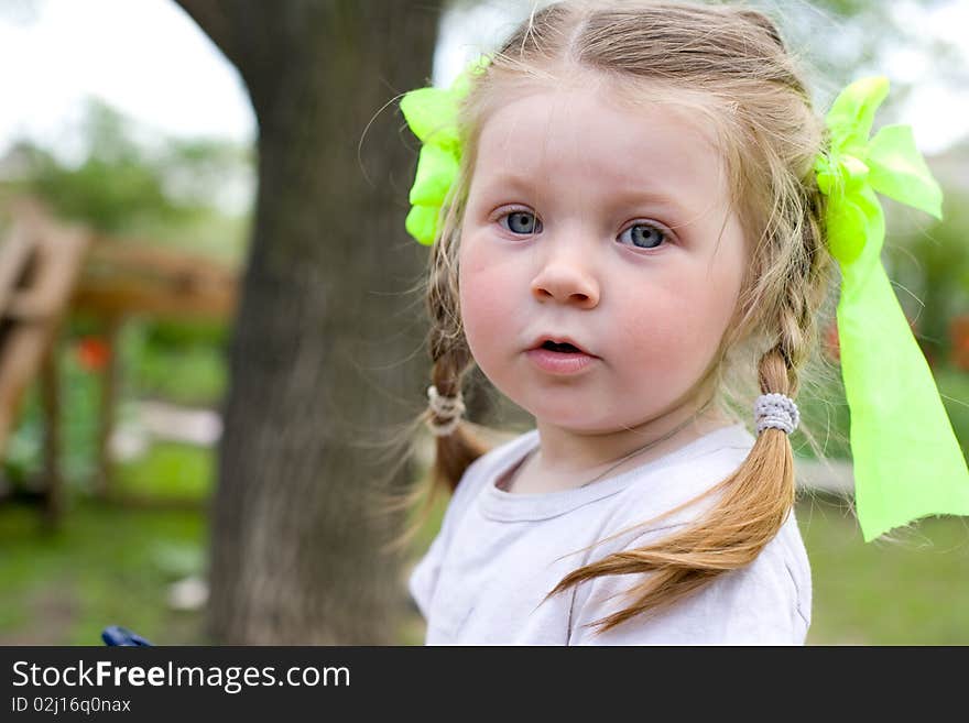 Little girl playing in the garden