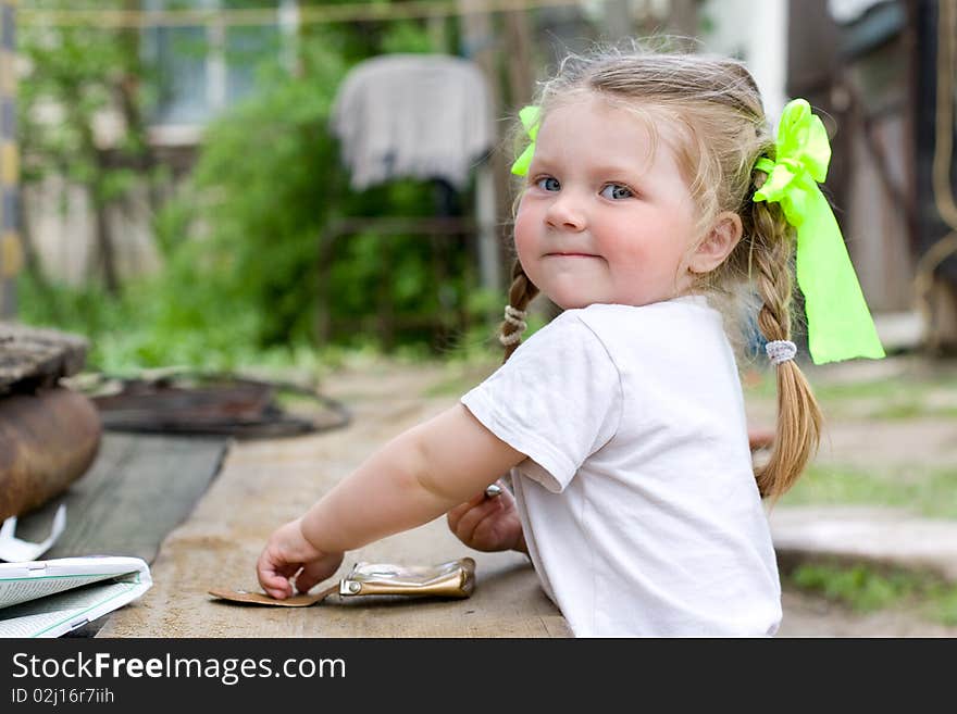 Little girl playing in the garden